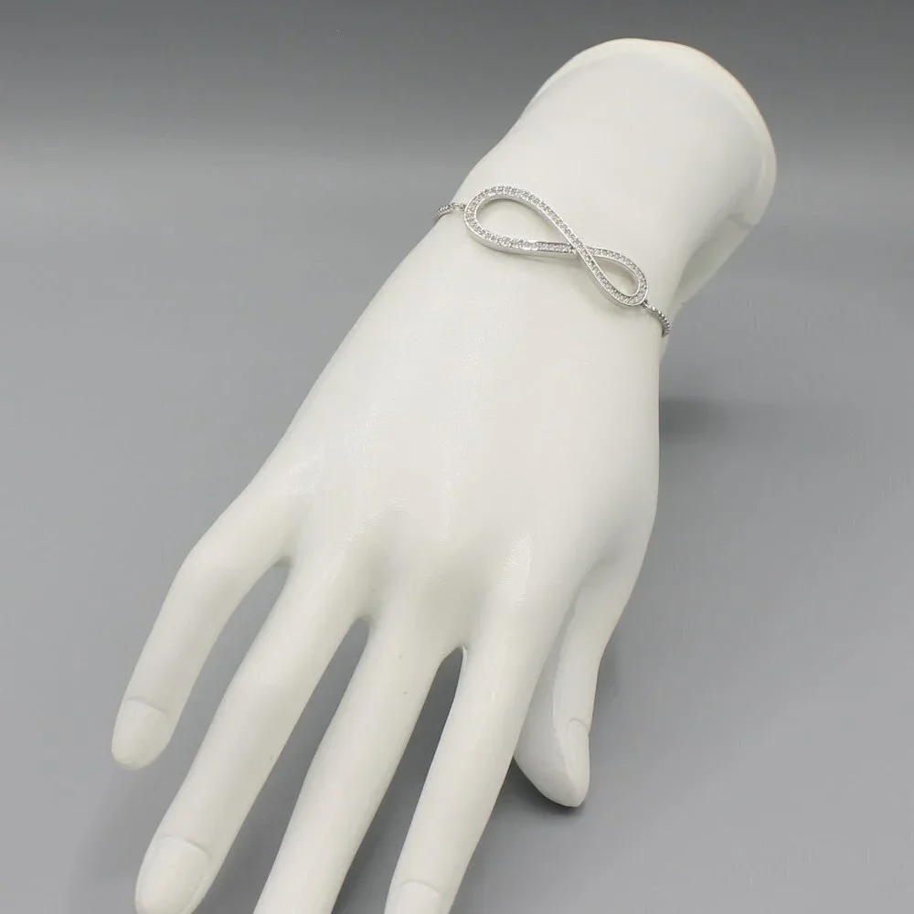 Jewelry bracelet infinity style white gold tone with stones sparkly adjustable